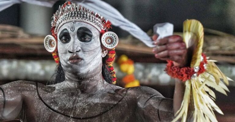 Parades - A man in a costume with white face paint and feathers