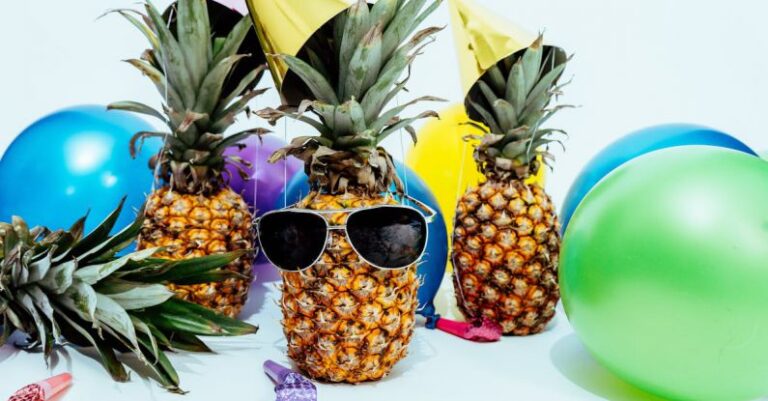 Party - Photo Of Three Pineapples Surrounded By Balloons