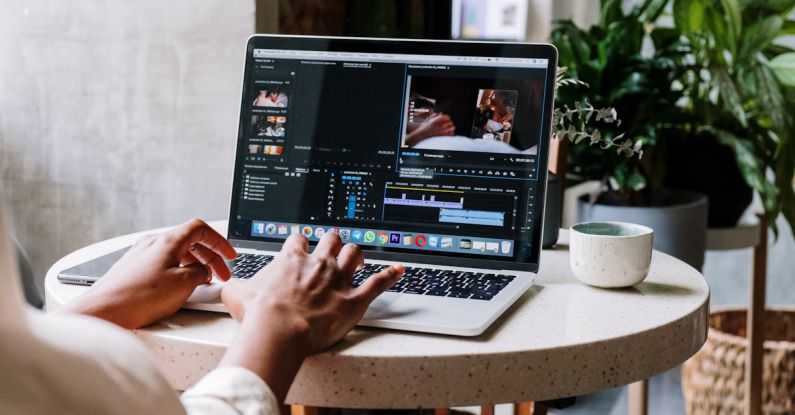 Premieres - Person Using Macbook Pro on White Table