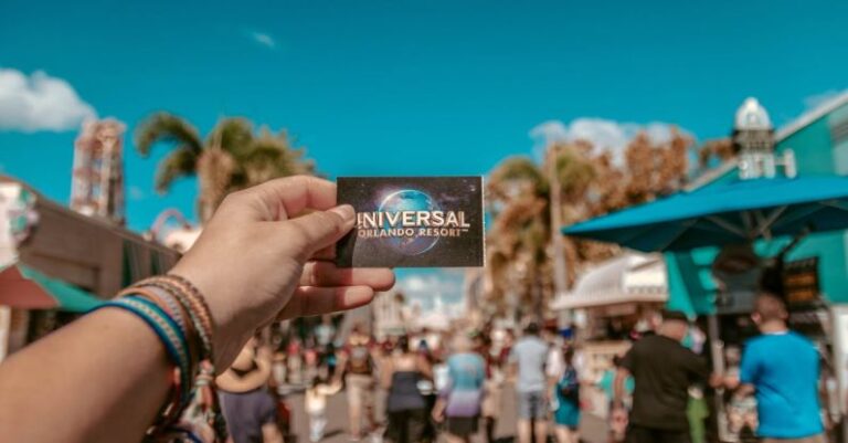 Tickets - Person Holding Universal Studios Ticket