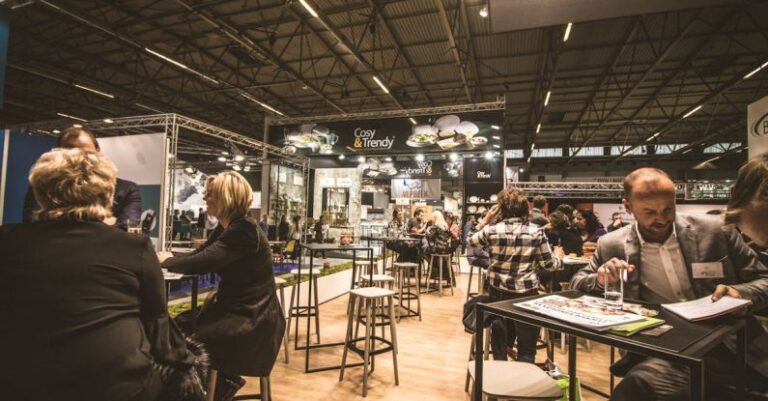 Networking - People Inside a Cafe With Tables and Chairs