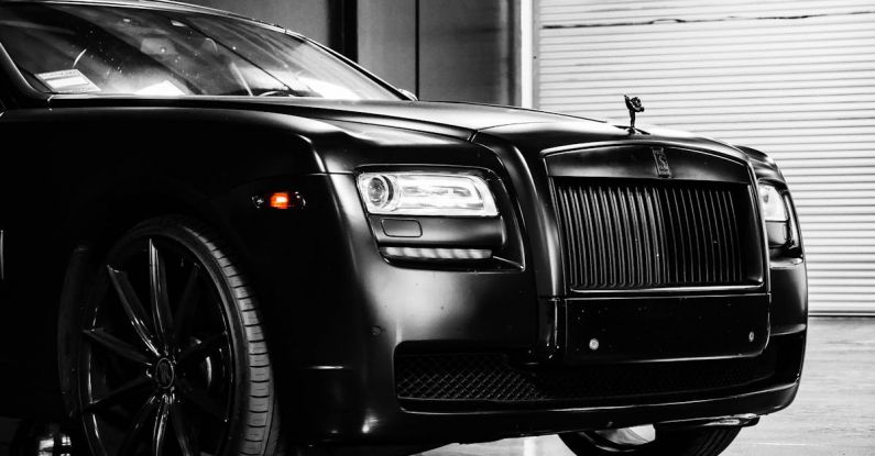 Expo - Hood of elegant luxury black car parked on marble floor in modern building garage